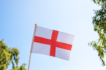 Flag of England in the sky. Nature summer background.の写真素材