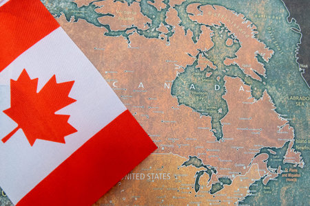 National flag of Canada on the world map background.の写真素材