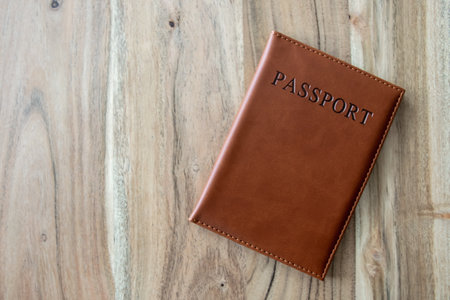Passport with space for text on the wood background. Travel, business or emigration concept.の写真素材