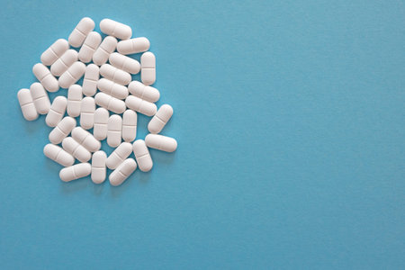 Much medical tablets on the blue background. Healthcare concept. Space for text.