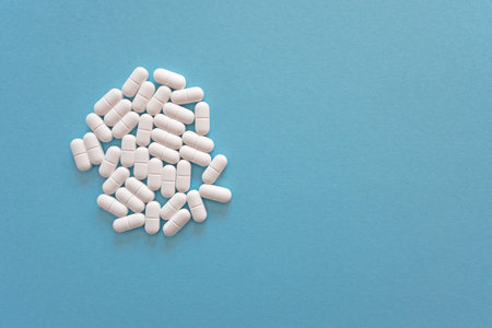 Much medical tablets on the blue background. Healthcare concept. Space for text.