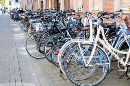 Urban street in big city with bikes. Bicycles stay on the parking in Ostend, Belgium.