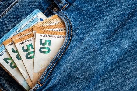 Jeans with euro money. Bills in the pants pocket for commerce concept.の写真素材