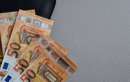 Black with euro money. Paper bills in leather wallet for commerce concept.