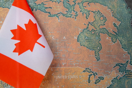 National flag of Canada on the world map background.の写真素材