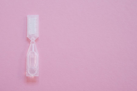 Eye drops in small disposable plastic multidose ampoule. Space for text.の写真素材
