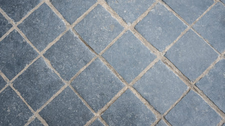 Gray brick wall background. Stone blocks surface with horizontal texture of square brick.