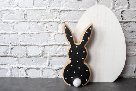 Black and white wood rabbit and egg for easter background. Shopping of Easter holidays. Space for text.の写真素材