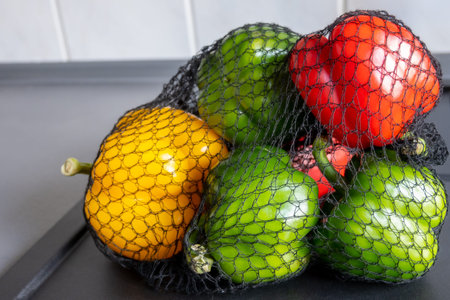 A lot of sweet paprika in the natural eco grid for cooking. Red, yellow, green fresh pepper....