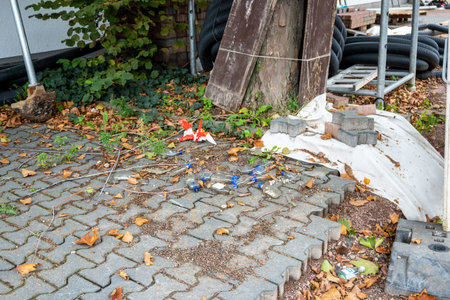 A lot of empty little alcohol bottles on the dirty street after party.