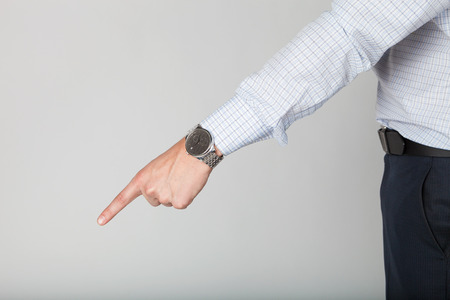 A Young business man's hand points something out by its index finger.の写真素材