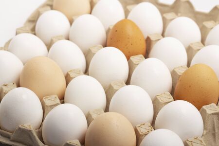 Raw eggs lie in shape on a white background. Diet, healthy food, weight loss, natural productsの写真素材