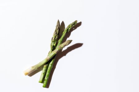 Green fresh asparagus on a gray backgroundの写真素材