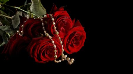 Necklace and roses. Islated on black. Copyspace for textの写真素材