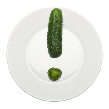 Green cucumber on white plate. Isolated on whiteの写真素材
