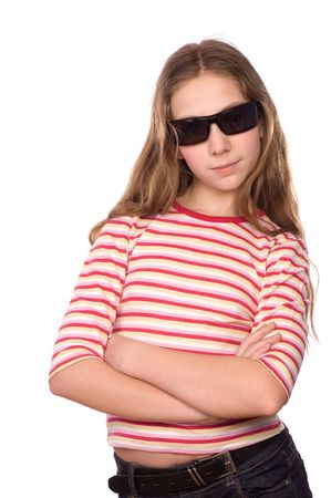 Teenage girl wearing sunglasses with crossed hands isolated on whiteの写真素材
