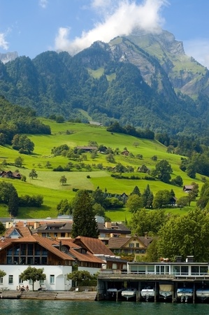 Alpine hill with settlement and harborの写真素材