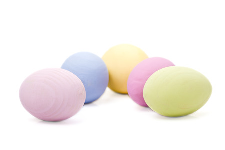 Five pastel colored wooden Easter eggs の写真素材