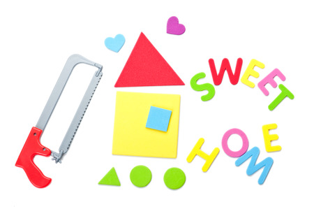 Handsaw with house and sweet home sign	の写真素材