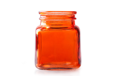 Empty orange glass jar isolated on white の写真素材