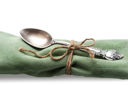 Silver spoon with napkin and twineの写真素材