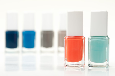 Two bright modern nail polish bottles with others の写真素材
