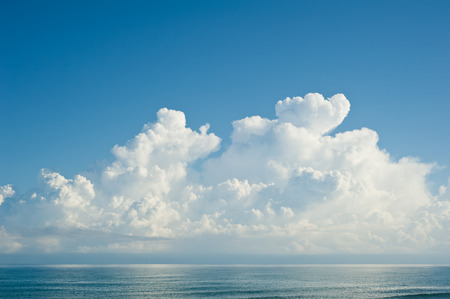Beautiful fluffy cloud over sea in the morningの写真素材