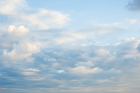 Blue and pink painterly clouds and skyの写真素材