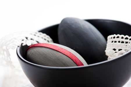 Easter eggs in black pot with laceの写真素材