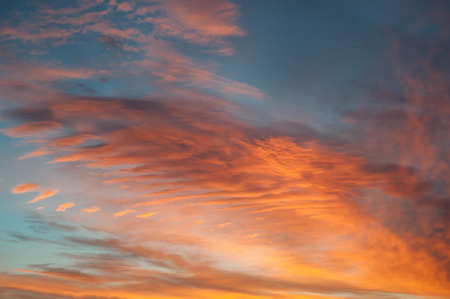 Colorful dawn sky with orange cloudsの写真素材