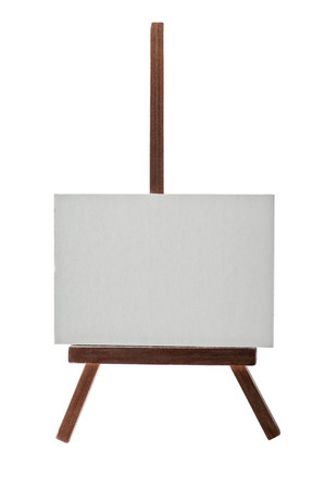 Dark wooden easel with blank canvas isolated on white の写真素材