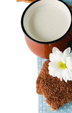 Brown mug with milk and cinnamon and cookiesの写真素材