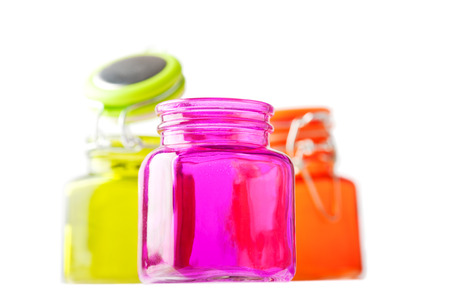 Multicolor glass jars on whiteの写真素材