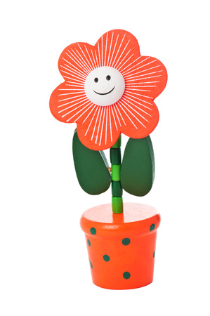 Floppy Wooden Flower Toy in a bright pot isolated on whiteの写真素材