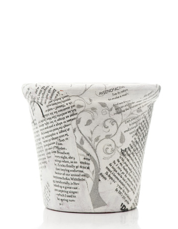 News paper decorated flower pot on white backgroundの写真素材