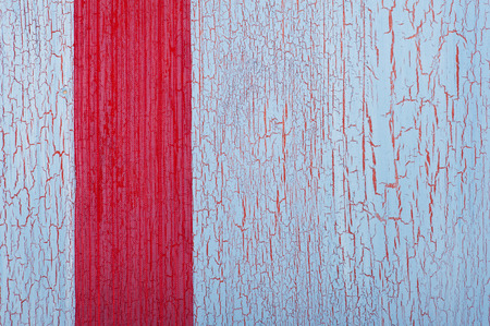 Red ribbon on shabby blue red background with cracklesの写真素材