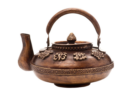 Antique iron tea pot isolated on white backgroundの写真素材
