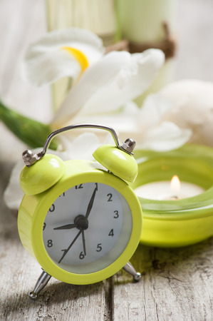 SPA still life, alarm clock, bath products, wooden backgroundの写真素材