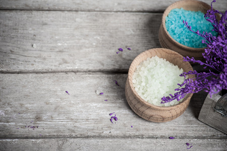 SPA still life, Bath Salt closeup with violet flowers on wooden background. Desaturatedの写真素材