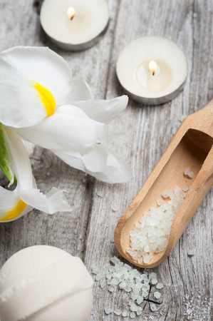 SPA still life, Bath Salt closeup with lit candles on wooden backgroundの写真素材