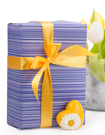 Purple gift box with yellow heart and ribbon, tulipsの写真素材