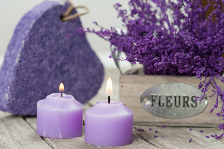 SPA still life, Purple pumice closeup with violet flowers on wooden background.の写真素材