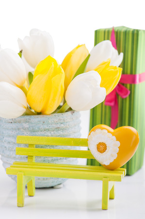Yellow heart, gifts and tulips. Valentine's, Easter, Birthday, Mother's Day still lifeの写真素材