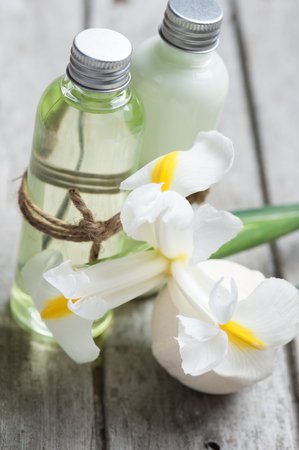 SPA still life, bath products, flowers, wooden background, greenの写真素材