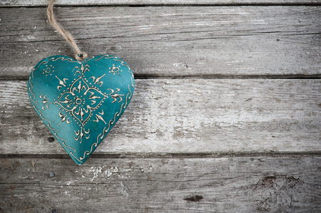 Weathered old wooden background with blue heart. Copy Spaceの写真素材