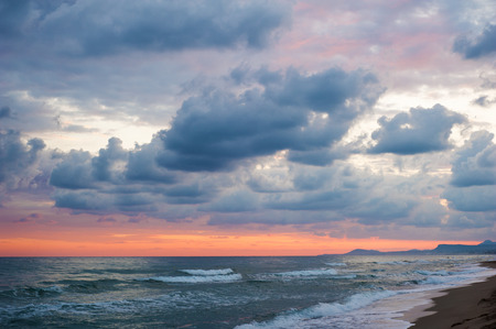 Dramatic colorful clouds and sea. Pink orange sunriseの写真素材