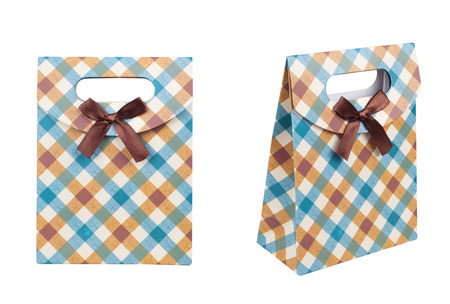 ?heckered blue brown gift bag with bow. Isolated on whiteの写真素材