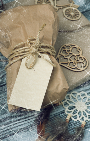 Christmas gift with empty tag on wooden background. Craft wrapping and dream catcher decoration.
Snow and starsの写真素材