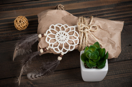 Set of decoration for gift wrapping. Craft package, dream catcher, twine flat lay compositionの写真素材