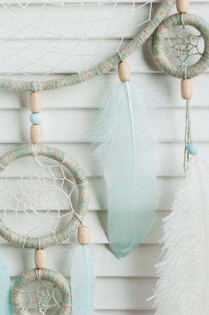 Dream catcher with mint feathers in the interior. Close upの写真素材